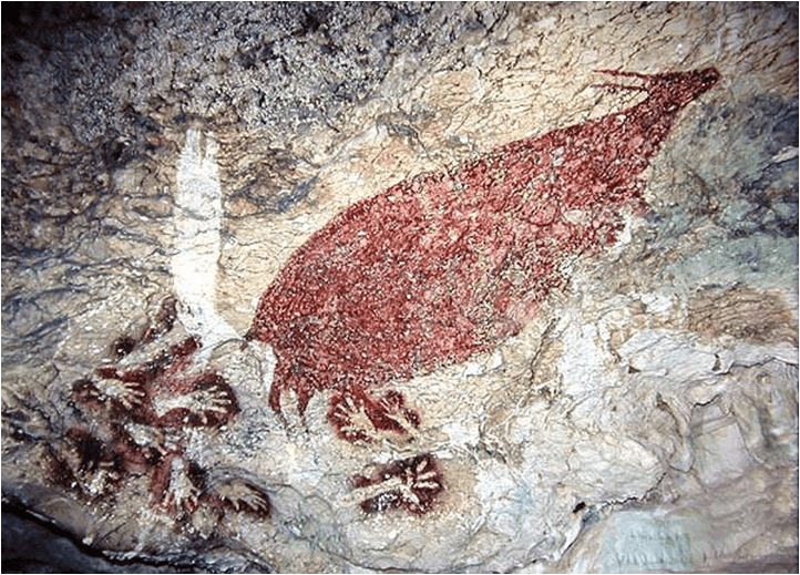 Lukisan cap tangan dan seekor babi di Gua Leang peninggalan masa praaksara